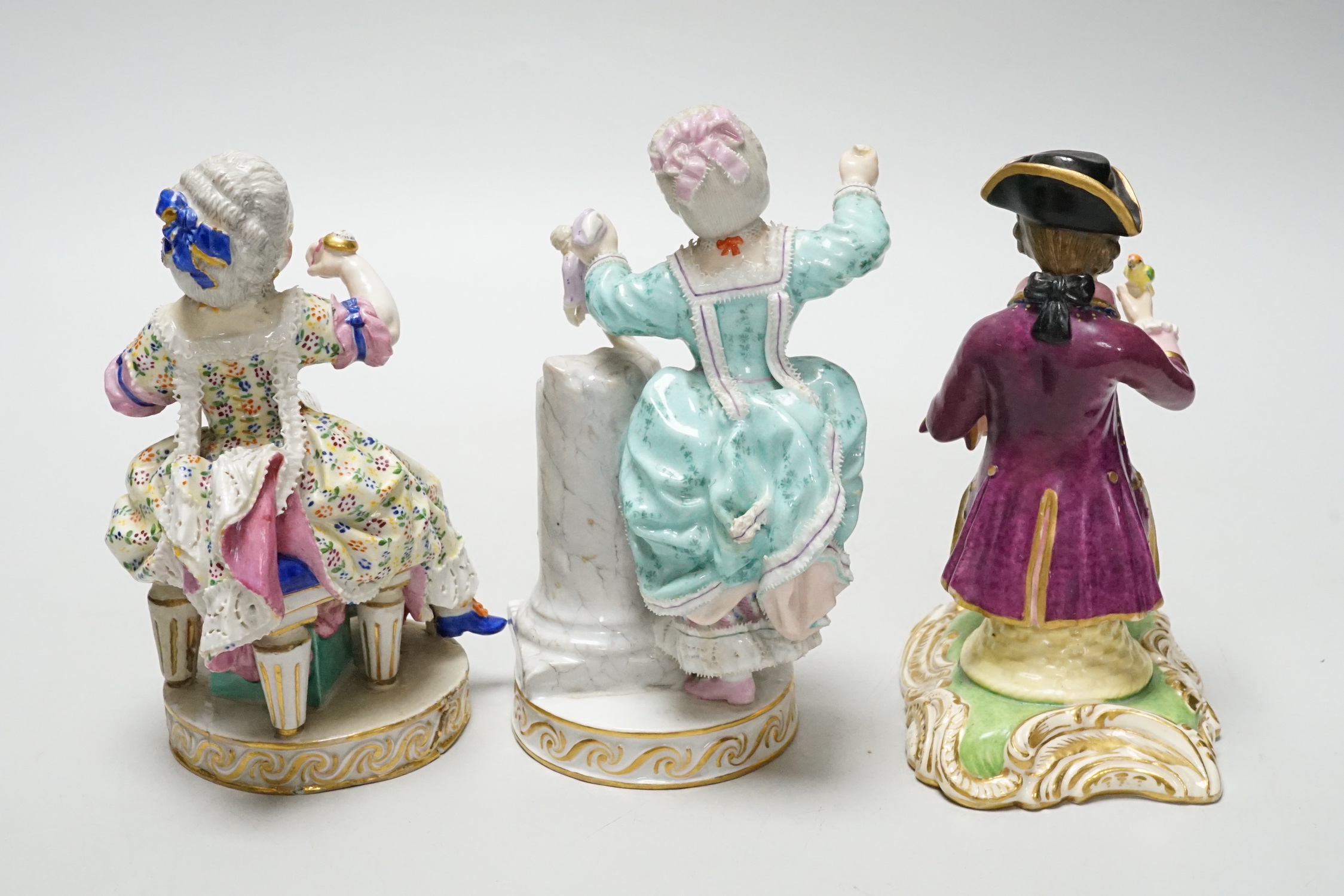 Three Meissen figure groups (with damage), tallest, figurine holding a doll, 15.5cm high